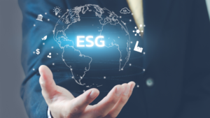 man holding graphic of globe showing ESG